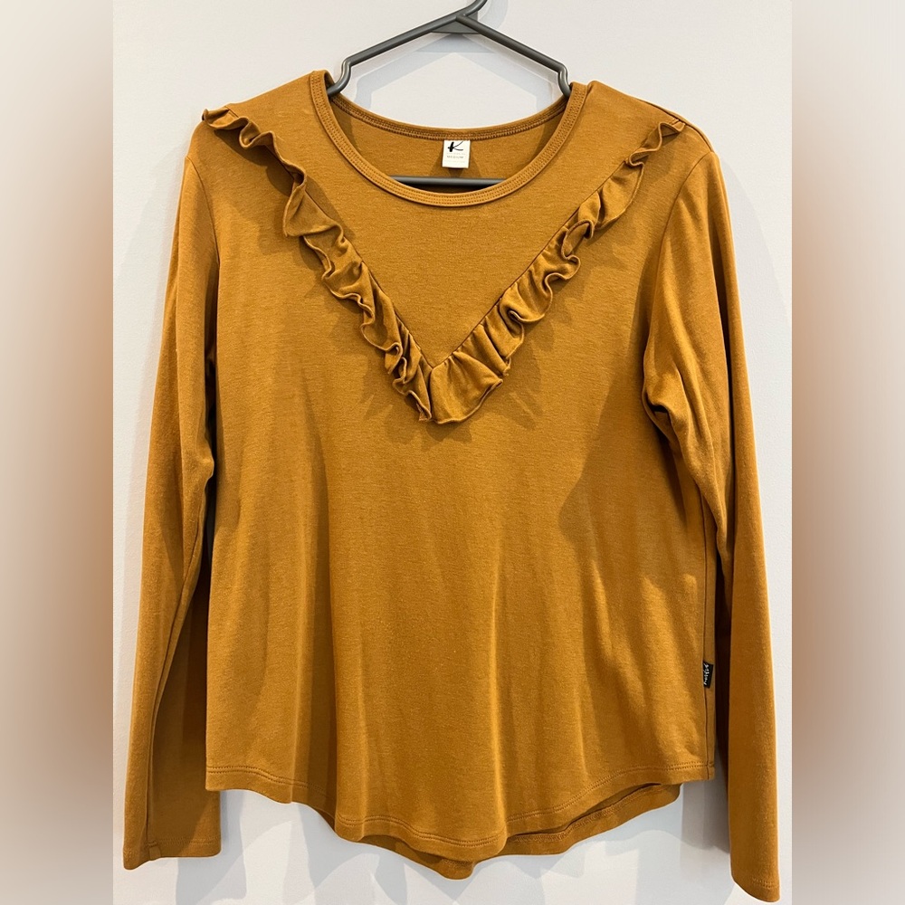Kindred top with ruffle detail.